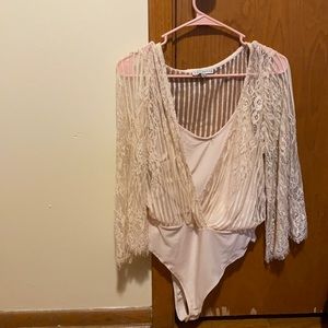 Tan/cream bodysuit cover by a floral sheer
